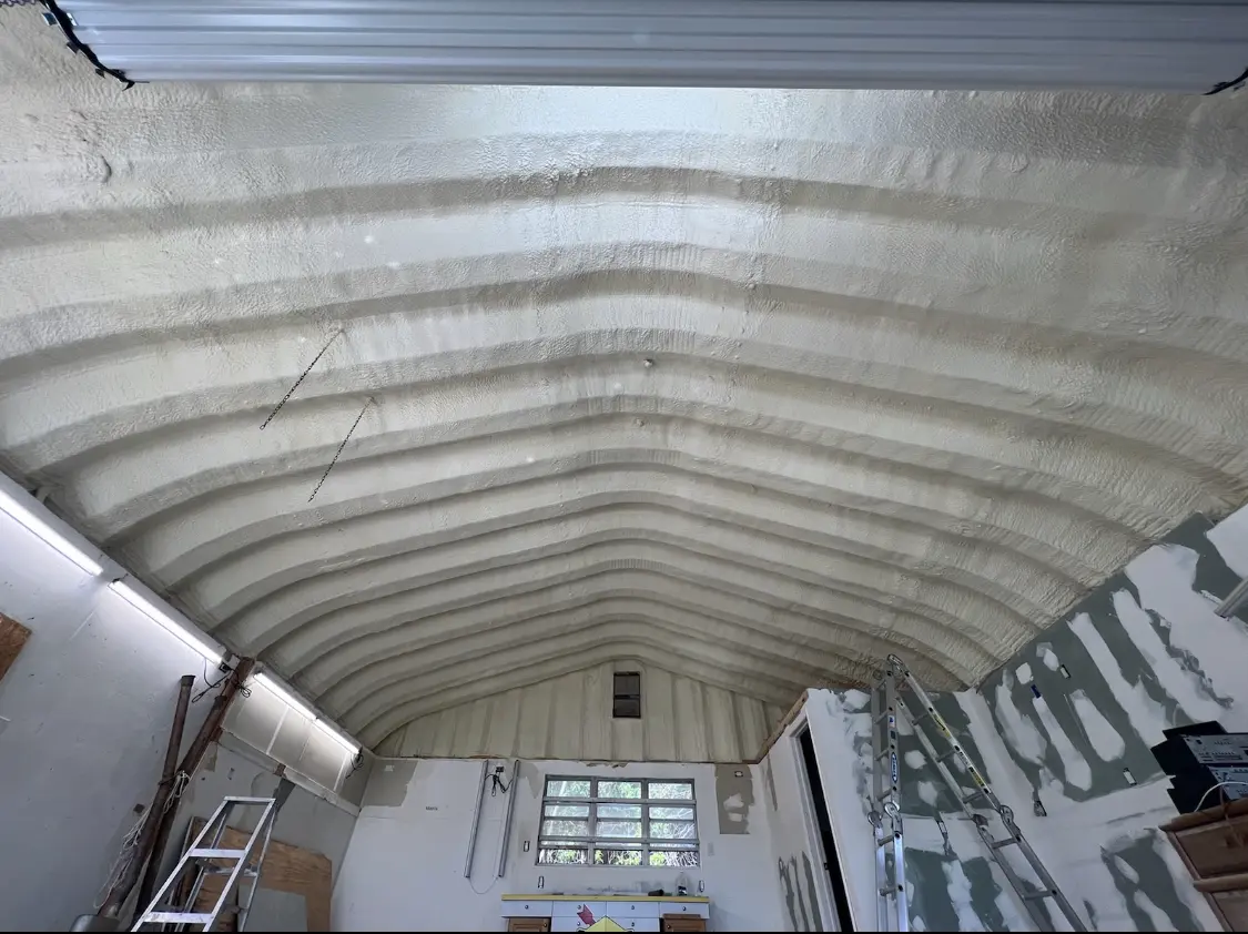 Spray polyurethane foam applied to the underside of a metal roof deck in Boca Raton